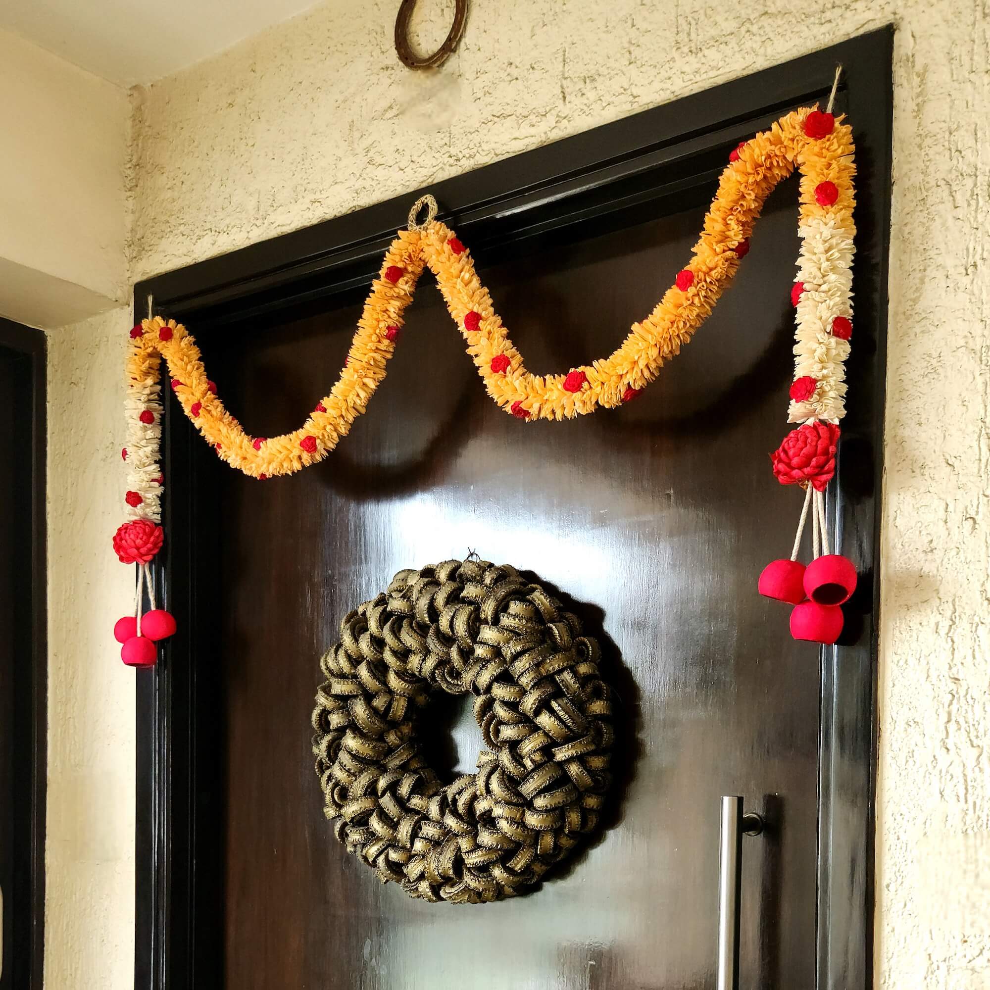 Handcrafted Vaastu floral toran with Rajnigandha & Bael fruit