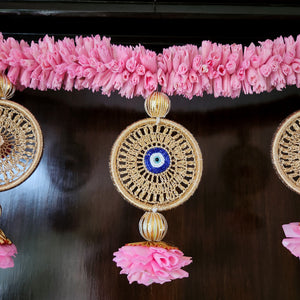 Traditional Vaastu toran with natural flowers and pods