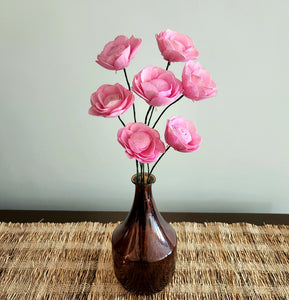 Pink sola wood roses in a vase for table decor